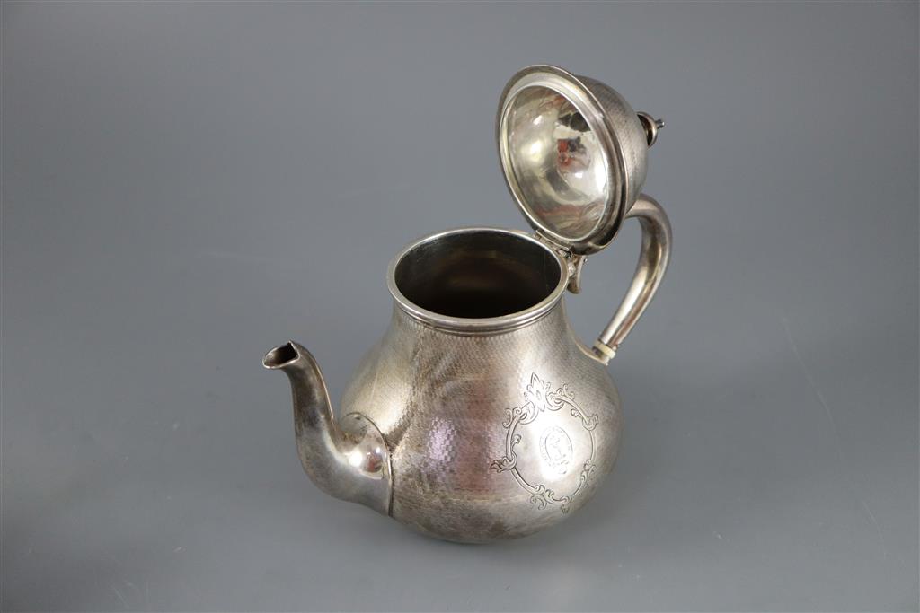 A Victorian engine turned silver three piece tea set by Richards & Brown,